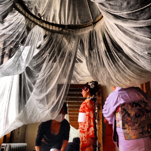 Model being dressed by expert staff. Kyoto, Japan. Photograph by cory Lum. Instagram via @corypix